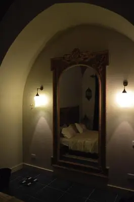 a bedroom with a mirror and a bed in it at El Gouna 4 Bedroom 4 Bathroom Lagoon villa in Banī Ghālib