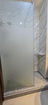 a shower with a glass door in a bathroom at Tiba Golden Azure Coast Hurghada in Hurghada
