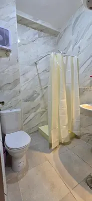 a bathroom with a toilet and a sink at Tiba Golden Aqua Vista Hurghada in Hurghada
