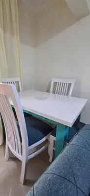a table and two chairs with a white table and two chairs at Tiba Golden Sunset Oasis Hurghada in Hurghada