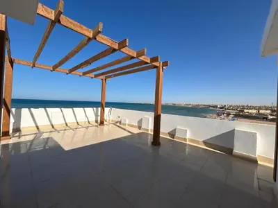 a view of the ocean from the roof of a house at Sea view chalet in Sahl Hasheesh