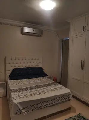 a bedroom with a bed in a room at Hurghada in Hurghada