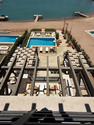 an aerial view of a beach with two swimming pools at Gouna's Best Villa in Hurghada