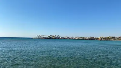 a large body of water with a city in the background at TiBa Golden Resort in Hurghada