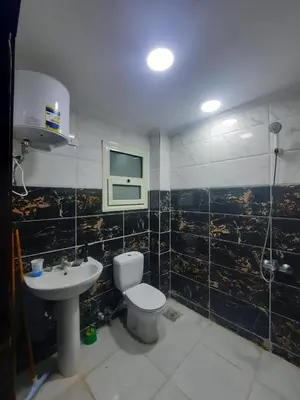 a bathroom with a toilet and a sink at الغردفه كازبلانكا ريزورت in Hurghada