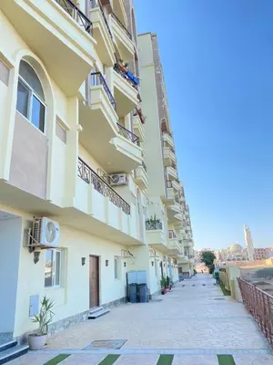 a building with balconies on the side of it at الغردفه كازبلانكا ريزورت in Hurghada