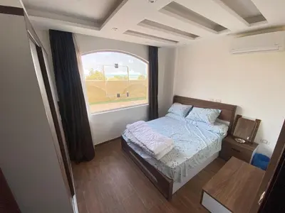 a small bedroom with a bed and a window at الغردفه كازبلانكا ريزورت in Hurghada
