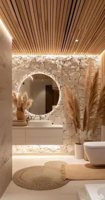 a bathroom with a stone wall and a mirror at Amber Cruise in Luxor