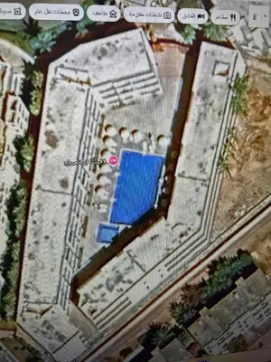 an overhead view of a building with a swimming pool at شالية فى قرية ميراج باى الغردقة in Hurghada
