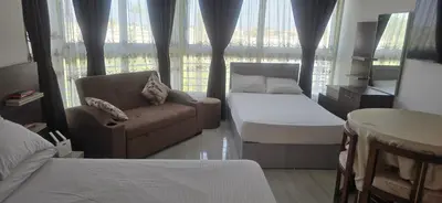 a room with a couch and a bed and a window at فندق ميراج باي in Hurghada