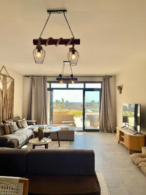 a living room with a couch and a table at Villa with pool Miska Soma Bay in Hurghada
