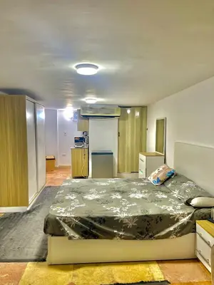 a bedroom with a large bed in a room at Lotus Compound in the Inter Area in Hurghada