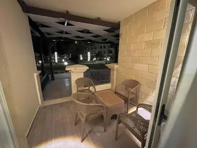 a balcony with chairs and a table on a balcony at 1BR Relaxing Seaside Retrear Shal Hasheesh in Hurghada