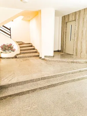 a stairway in a building with stairs and a building at Majestic apartments in Hurghada