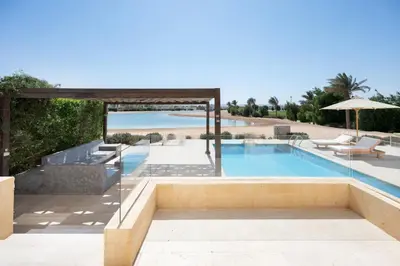 a swimming pool with a view of the beach at VESTA - El Gouna Residence in Hurghada