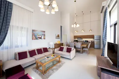a living room with a couch and a table at VESTA - El Gouna Residence in Hurghada