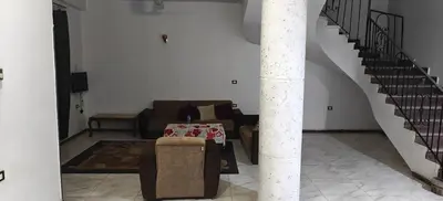 a living room with a couch and a table at THE Nile Diamond Guest House in Luxor