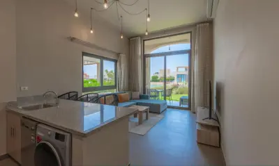 a kitchen and living room with a washer and dryer at Luxury Stays in Tawila El Gouna in Hurghada