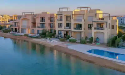 a row of houses next to a body of water at Luxury Stays in Tawila El Gouna in Hurghada