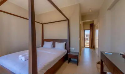 a hotel room with a bed and a desk and a bed at Luxury Stays in Tawila El Gouna in Hurghada