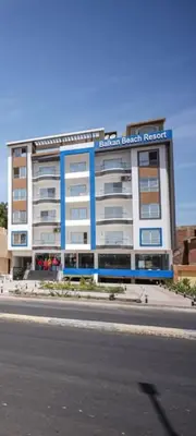 a building on the side of a street at Luxury apartment with beautiful view and free private beach in Hurghada