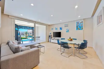 a living room with a couch and a table at Special apartment with Pool and Seasideview, El Gouna in Hurghada