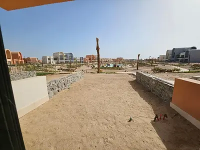 a view of a desert with buildings in the background at Cozy 1BR Retreat in Gouna in Hurghada