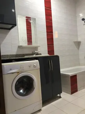a washing machine in a bathroom with a sink at sheraton street in Hurghada