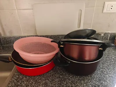 two pots and a strainer on a kitchen counter at Bayt Hassan A11 - 2 bedrooms spacious appartment in Hurghada