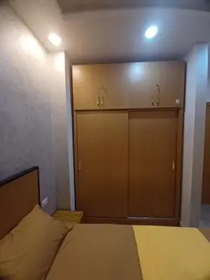 a bedroom with a bed and two closets in it at ميراج باي ريزورت منتجع لافستا in Hurghada