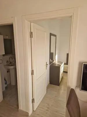 an open door to a room with a bathroom at Cozy one bedroom apartment in AquaPalms resort in Hurghada