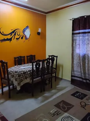 a room with a table and a butterfly on the wall at Sea view in Quseir