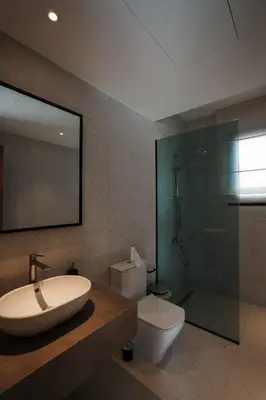 a bathroom with a sink and a toilet and a shower at Fanadir Marina Plunge Pool & Sea View in Hurghada