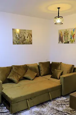 a living room with a brown couch in a room at One bedroom apartment with living room in Aqua Infinity before El Gouna in Hurghada