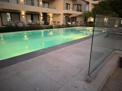 a swimming pool in front of a building at G cribs cozy 1bd apartment in El Gouna