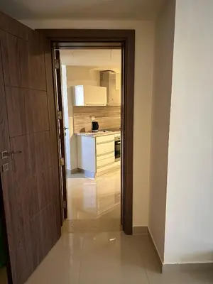 an open door to a kitchen with a counter at G cribs cozy studio in El Gouna