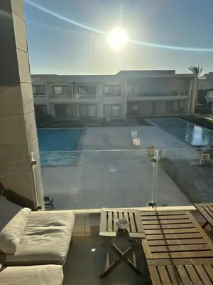 a large swimming pool in front of a building at Elgouna G cribs b-7 first floor in Hurghada