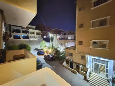 an aerial view of a street at night from a building at Sheraton - New & Stylish Flat in Hurghada