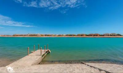 a dock in the middle of a large body of water at Luxury Stays in Sabina El Gouna in Hurghada