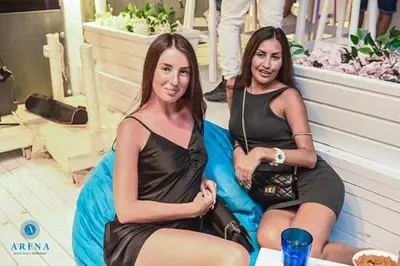 two women sitting on a bean bag chair at SELENA BAY Luxury Suite beach front hurghada Arena Bar & restaurant سويت فاخر سيلينا باى in Hurghada
