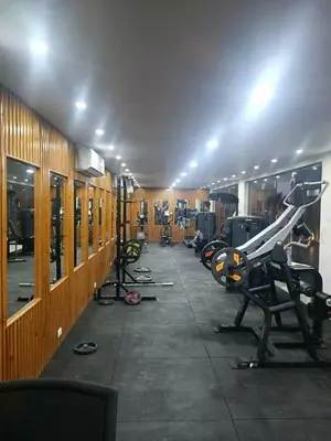 a gym with several treadmills and machines in a room at منتجع سكانديك الغردقة in Hurghada