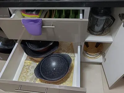 a drawer with hats and other items in a kitchen at Hurghada Studio Tiba Golden Resort in Hurghada