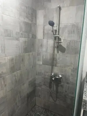 a shower in a bathroom with a glass door at Scandic resort chalet sea view in Hurghada