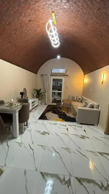 a living room with a couch and a table at Top in Hurghada