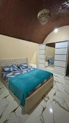 a bedroom with a bed and a mirror at Top in Hurghada