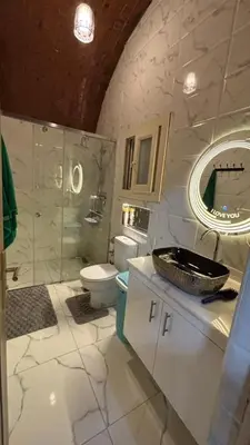 a bathroom with a sink and a toilet and a mirror at Sun Roof in Hurghada