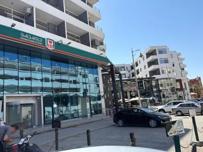 a person riding a motorcycle in front of a building at La Prestigia chalet in Hurghada