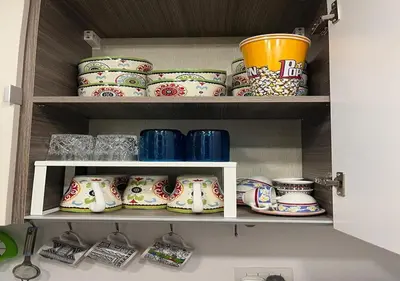 a cupboard filled with lots of plates and bowls at Studio at G Cribs B21-F10 El Gouna in Hurghada