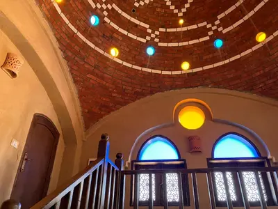 a staircase in a church with a domed ceiling at Sultana Palace in ‘Ezbet Abu Ḥabashi