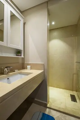a bathroom with a sink and a shower at Mangroovy 1BR + Sofa bed • Pool & Beach Access in Hurghada